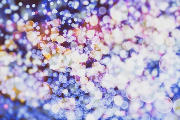 Fundo abstrato com bokeh desfocado luzes e estrelas — Fotografia de Stock