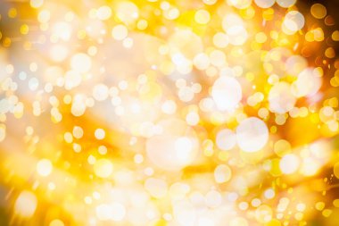 Doğal Bokeh ve parlak altın ışık şenlikli arka plan. Vintage sihirli arka plan rengi ile