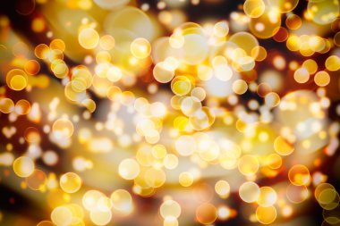 Doğal Bokeh ve parlak altın ışık şenlikli arka plan. Vintage sihirli arka plan rengi ile