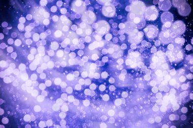 Bokeh ışıkları ve yıldız desenli şenlikli soyut arkaplan