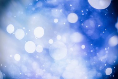 Bokeh ışıkları ve yıldız desenli şenlikli soyut arkaplan