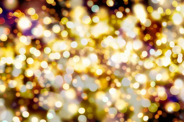 Sfondo festivo con Bokeh naturale e luminose luci d'oro. Vintage sfondo magico con colore — Foto Stock