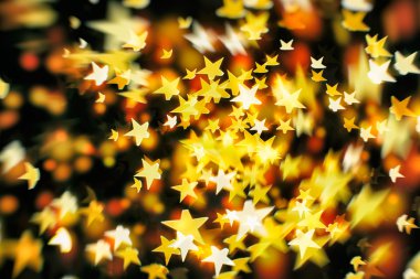 Bokeh ışıkları ve yıldız desenli şenlikli soyut arkaplan