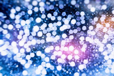 Bokeh ışıkları ve yıldız desenli şenlikli soyut arkaplan