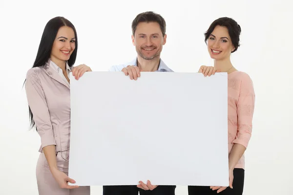 Cheerful  people holding copy space and smiling at camera while isolated on white — Stock Photo, Image