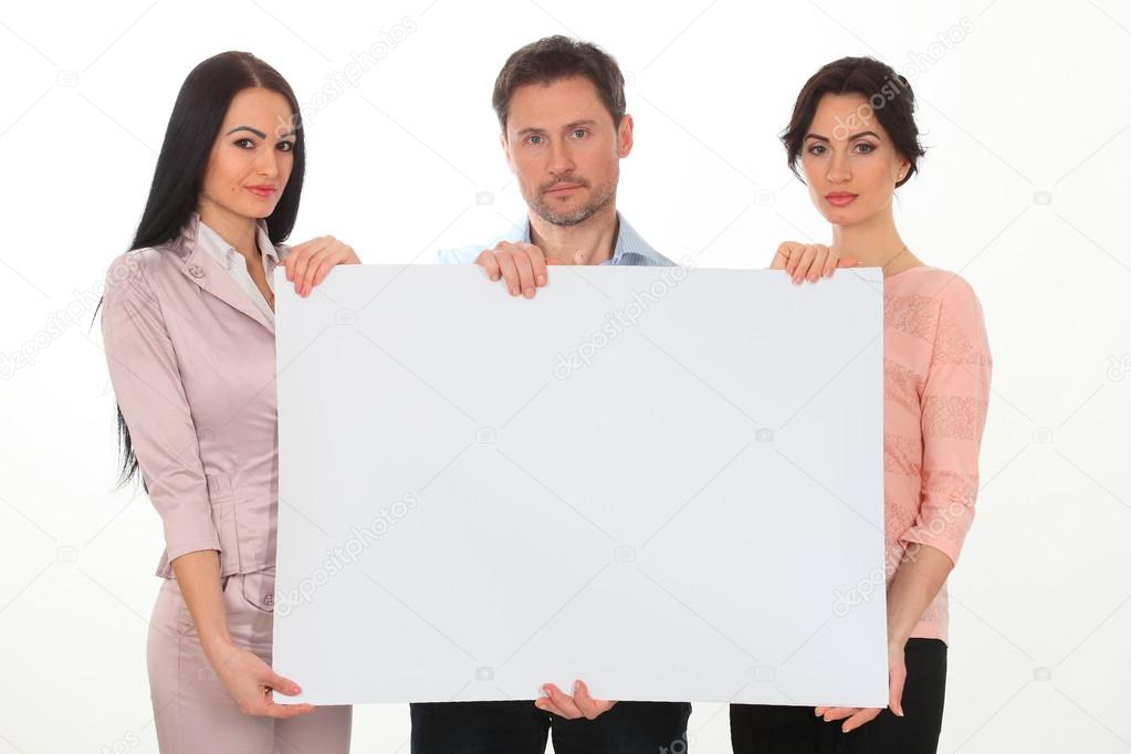 Cheerful  people holding copy space and smiling at camera while isolated on white