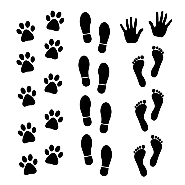 Vector set zwart voetafdrukken van mens en dier. — Stockvector