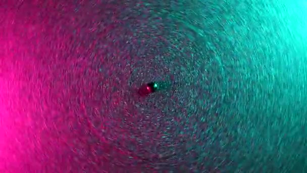 Retro-styled footage of spinning record in sequins on vinyl player. Top view. Colorful movie with neon pink and blue light. Analog Audio Equipment concept, vintage party. — Stock Video