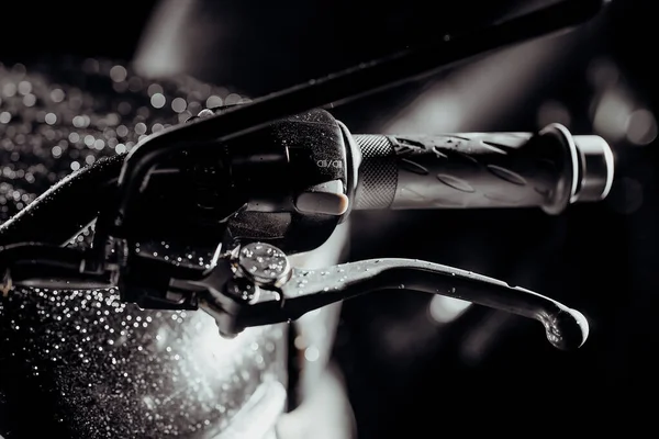 Handlebars of classic road bike. Design details of black retro styled motorcycle at night on dark background. Caferacers style, motor vehicle, travel concept. — Stock Photo, Image