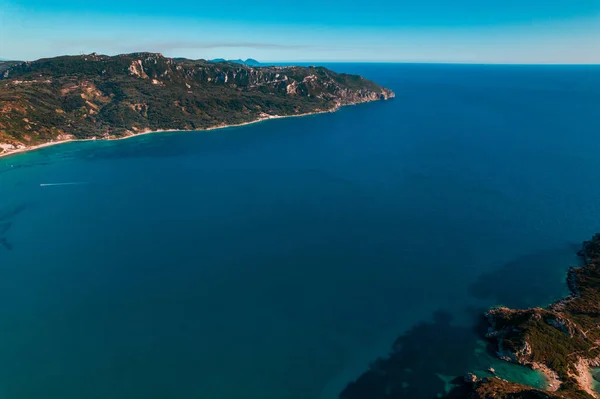 Aerial drone view to seascape with clear blue water. Amazing azure Mediterranean coast background. Travel destination, universal nature, resort, summer vacation. — Stock Photo, Image