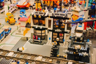 Prague, Czechia - September 20, 2025: LEGO Police Station featuring helicopter, patrol units, jail cells, and officers, presented in a detailed city diorama with vehicles and buildings.