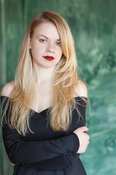 Young stunning attractive girl posing in black dress — Stock Photo, Image