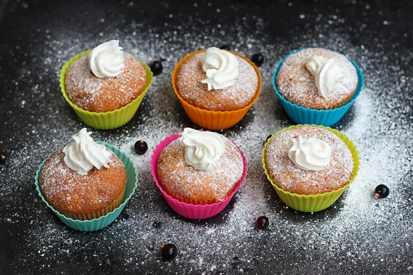 Muffins in colorful silicone forms — Stock Photo, Image