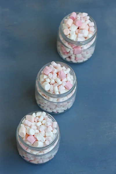 Three glass jars filled to brim marshmallow — Stock Photo, Image