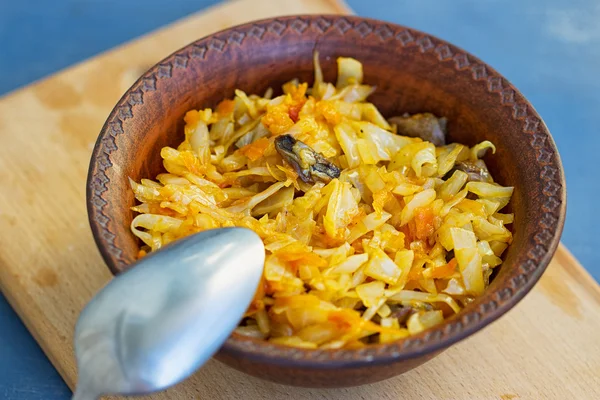 Braised cabbage in a wooden bowl — Stock Photo, Image