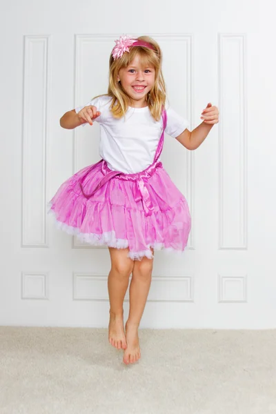 Jumping Excited Girl wearing beautiful dress — Stock Photo, Image