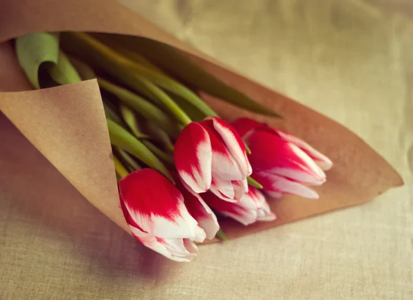 Tulips in parchment package. toning — Stock Photo, Image