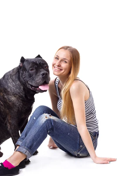 Girl sitting and smile  next to his dog Cane Corso — Stock Photo, Image