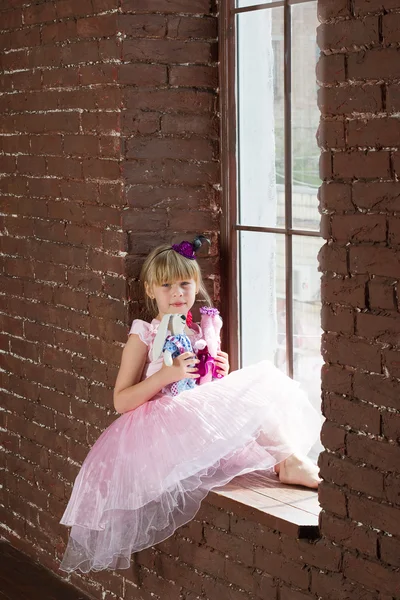 Girl 6 years old with homemade toys — Stock Photo, Image