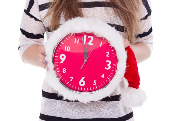 Big clocks a Christmas hat in female hands. New Year. 12 hours — Stock Photo, Image