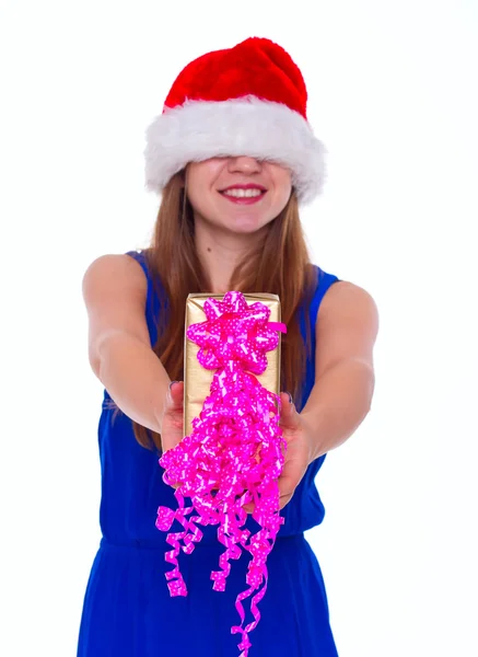 Young happy girl in Christmas hat and holding gift — Stock Photo, Image
