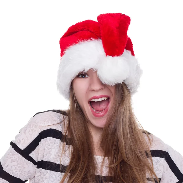 Экспрессивная эмоциональная девушка в рождественской шляпе на белом фоне — стоковое фото