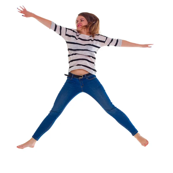 Young woman in jeans jumping — Stock Photo, Image