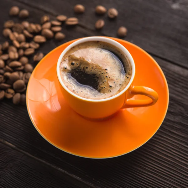 Orange cup of coffee — Stock Photo, Image