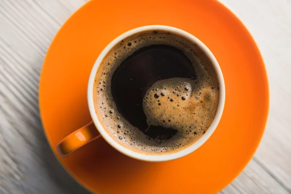 Orange kopp kaffe — Stockfoto