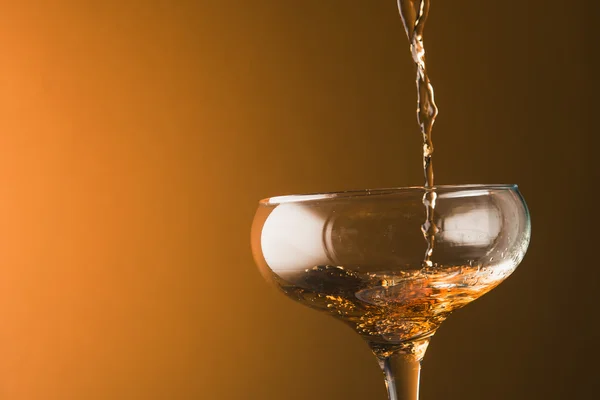 Splashes of champagne in a glass – stockfoto