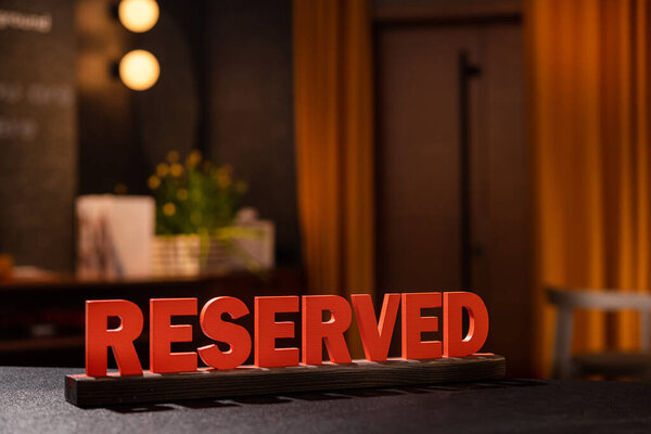 Reserved sign in hotel room. Accommodation booking concept.