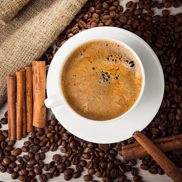 Coffee cup with beans — Stock Photo, Image