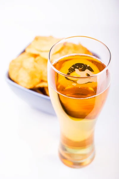 Glass of beer and chips — Stock Photo, Image