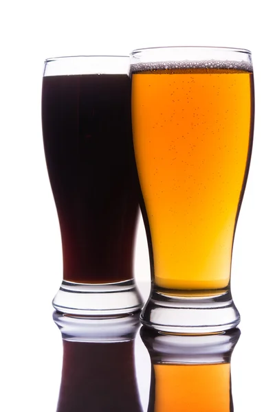 Dark and light beer into glasses — Stock Photo, Image