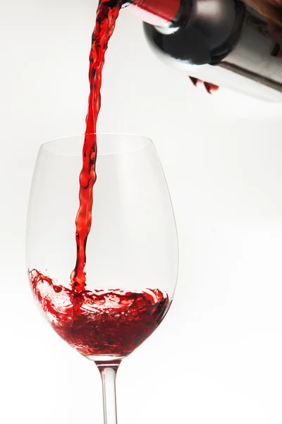 Pouring red wine in glass — Stock Photo, Image