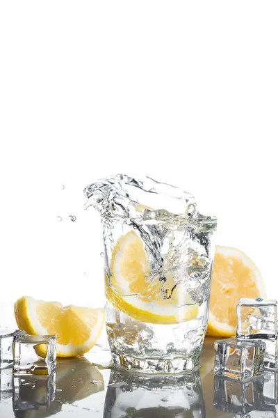 Splash of water with lemons — Stock Photo, Image