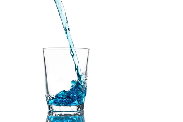 Pouring water into glass isolated — Stock Photo, Image