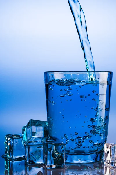 Pouring water into glass — Stock Photo, Image