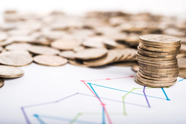 Pile of coins and plan — Stock Photo, Image