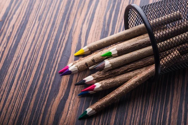 Color pencils in metallic basket — Stock Photo, Image