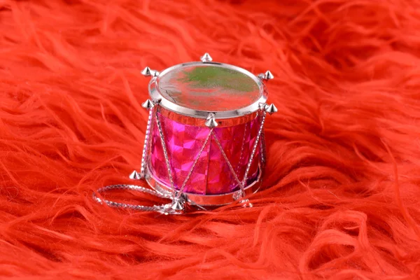 Christmas toy drum isolated on red background — Stock Photo, Image