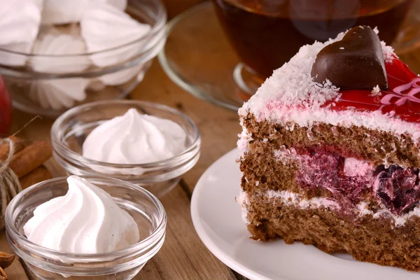 Chocolate Cake with tea cup and meringues — Stock Photo, Image