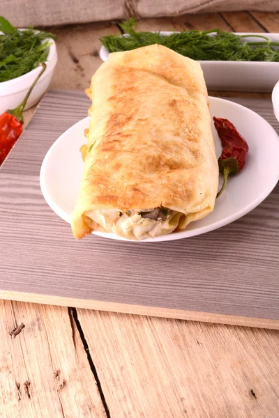 Burrito  - traditional Mexican food, on a white plate — Stock Photo, Image