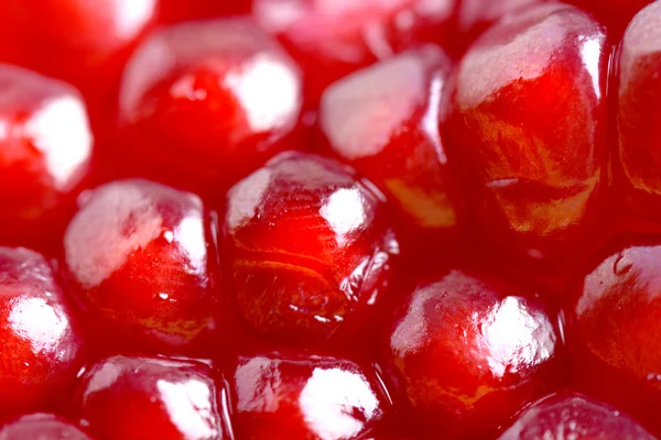 Pomegranate background. Macro of peeled ripe seeds — Stock Photo, Image