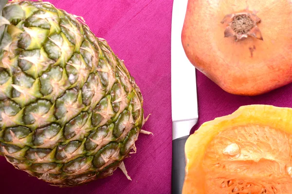 Fresh pineapple with pumpkin and knife — Stock Photo, Image