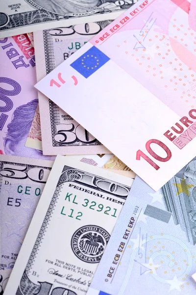 Heap from dollars, the ukrainian money and euro — Stock Photo, Image