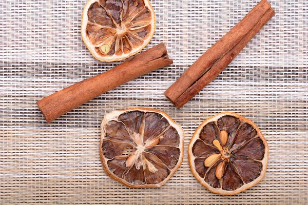 Slices of fresh dried lemon, orange and spices for cooking or baking — Stock Photo, Image