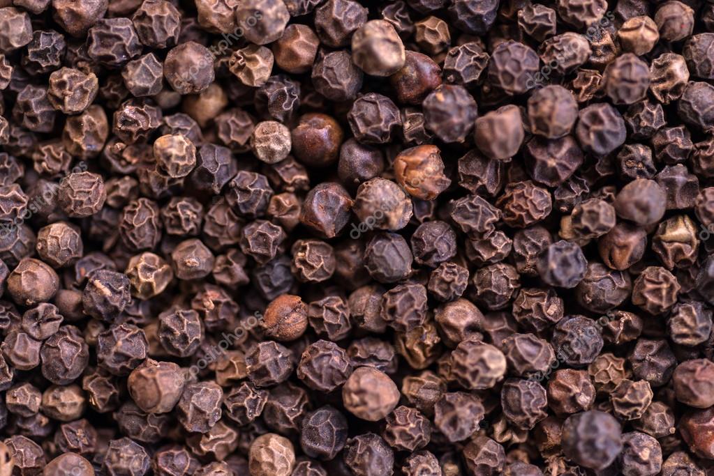 Black pepper — Stock Photo © fotoluxstudio 54190493