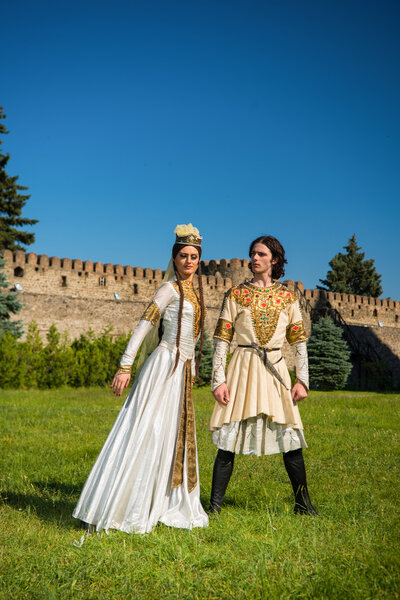 Man and woman in national dress of Georgia