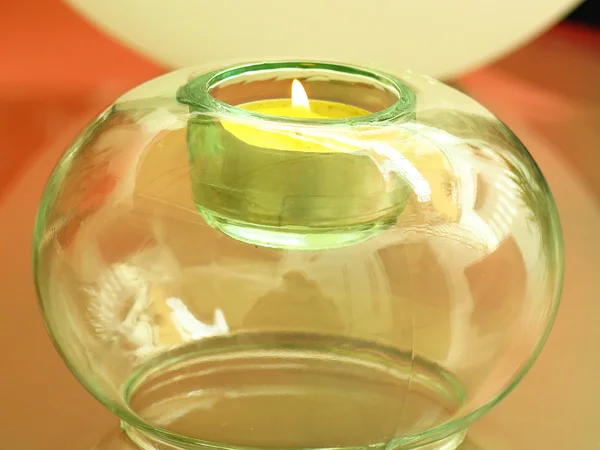 Candle in a glass candlestick — Stock Photo, Image